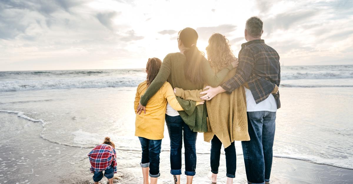Family walking together on the beach